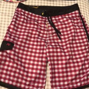 Men’s board 100% polyester shorts.  Size 34.